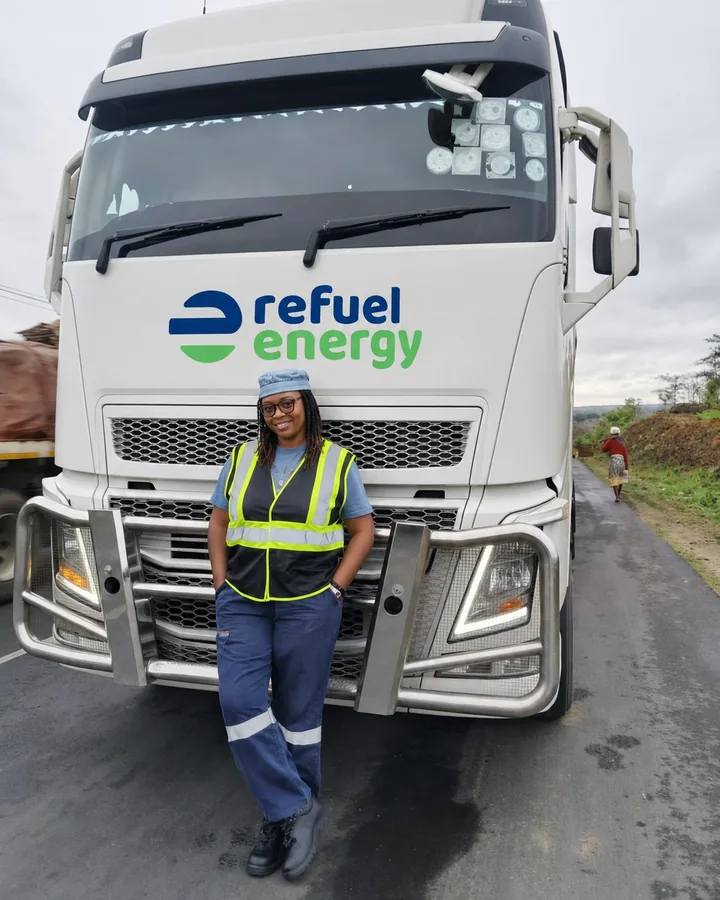 A Refuel Energy Limited team member beside a branded delivery truck
